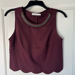 Lush Maroon Sleeveless Blouse with Embellished Neckline